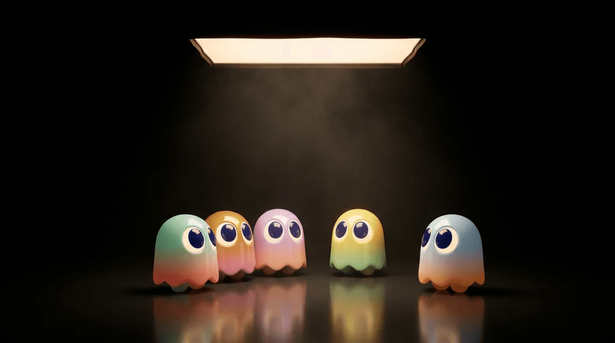 Five small pastel ghost characters standing together on a dark reflective floor, lit from directly above by a single warm softbox in an otherwise black room.